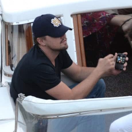 One of the world's highest paid movie stars, Leonardo DiCaprio, with his BlackBerry Bold 9700.