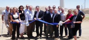 Western Wind Energy CEO Jeff Ciachurski cuts the ribbon at the company's 120 megawatt Windstar Project earlier this month.