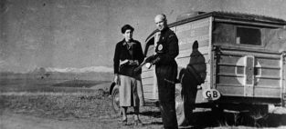 1936: Dr. Norman Bethune stands in front of The Canadian Blood Transfusion Unit which operated during the Spanish Civil War.