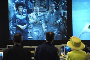 She's not new to this space thing. England's Queen Elizabeth II hears from the three-astronaut crew of Expedition 15 aboard the International Space Station. British-born NASA astronaut Mike Foale (center) hosted the May 8, 2007 event at the Goddard Space Center in Greenbelt, Maryland.