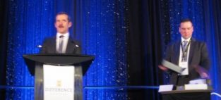 Colonel Chris Hadfield presents the award for Cantech Letter TSX Tech Stock of the Year with Cantech's Nick Waddell.