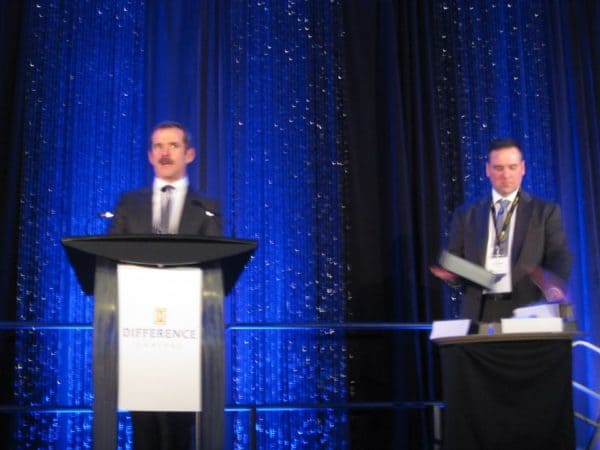 Colonel Chris Hadfield presents the award for Cantech Letter TSX Tech Stock of the Year with Cantech's Nick Waddell.